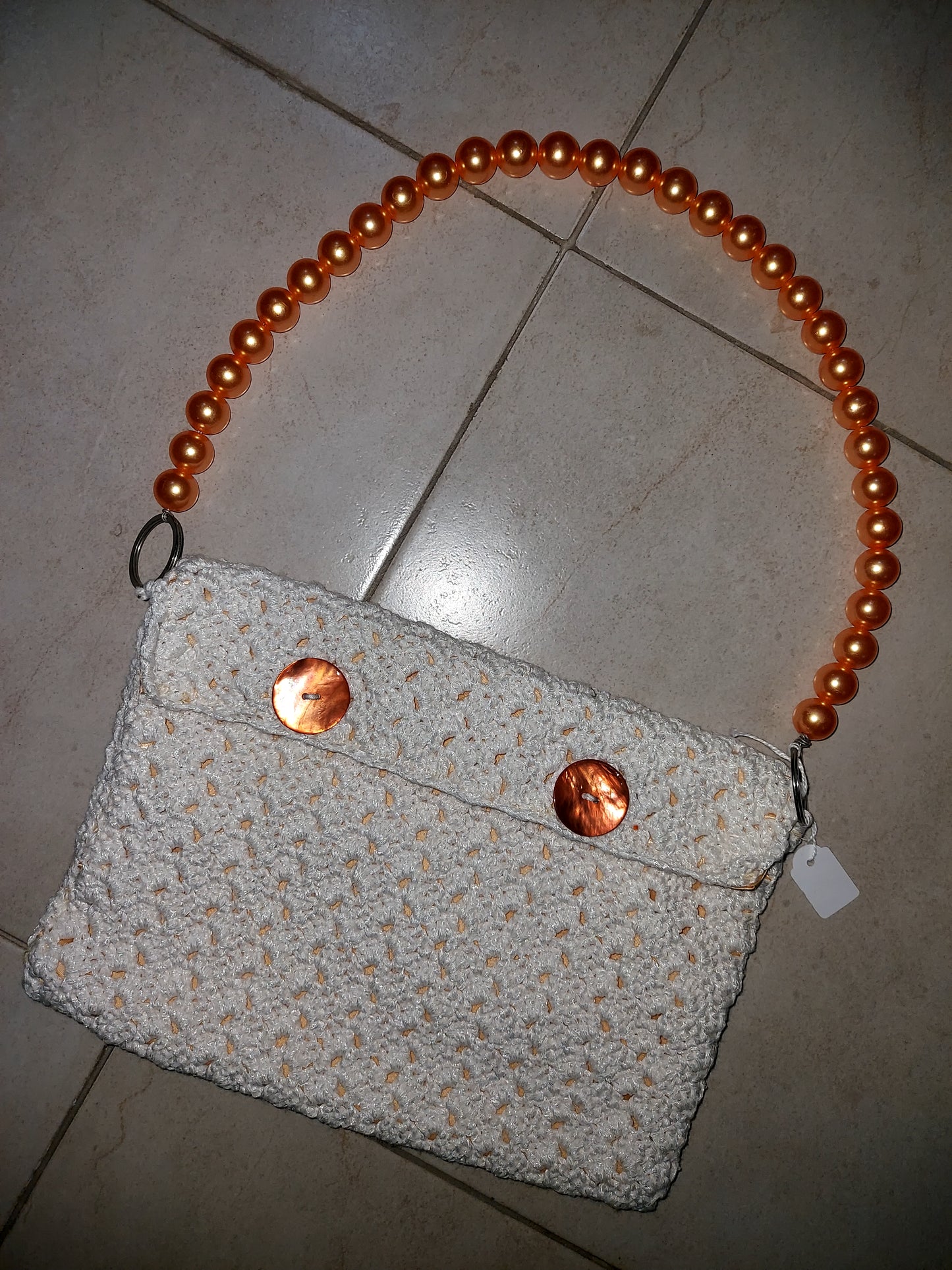 Pochette con manico in perle